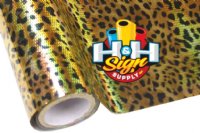 An image of a shiny textile foil with a leopard print pattern that appears to have a holographic effect. The foil reflects light in a way that creates a rainbow-like effect. 