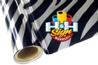 The image shows a piece of textile foil with a zebra design. The background of the foil is silver, and it has black stripes in a zebra pattern spread throughout the foil.